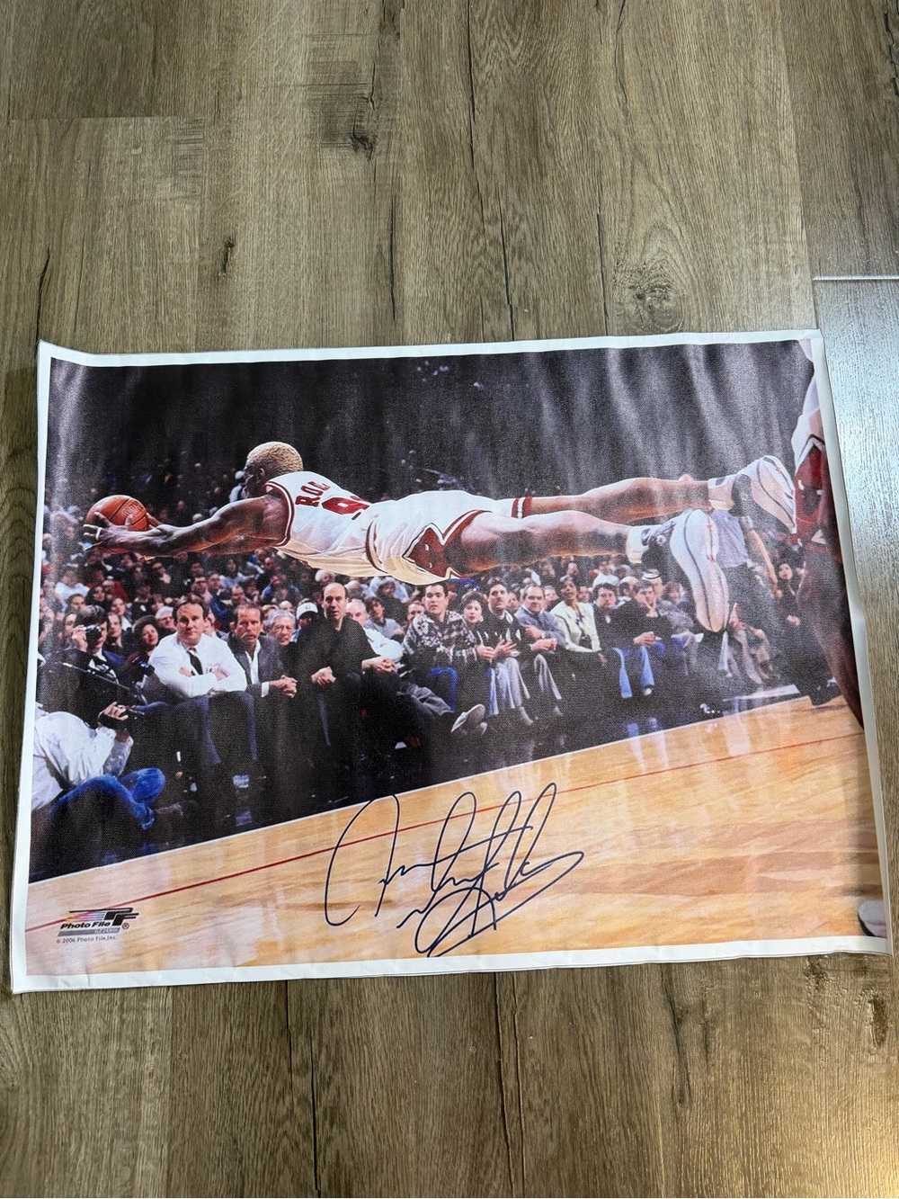 Photograph of a basketball moment (white and red)